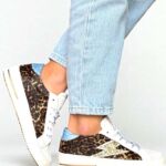 Guide des Tailles Semerdjian : Comment chaussent les sneakers SMR 23 ? | Corner Shoes - For Trendy Girl Basket femme Semerdjian SMR23 léopard avec éclair doré, sneakers tendance portées style urbain chic
